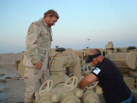 Mike Wunder fixing a fuel pump at Camp Buehring in Kuwait